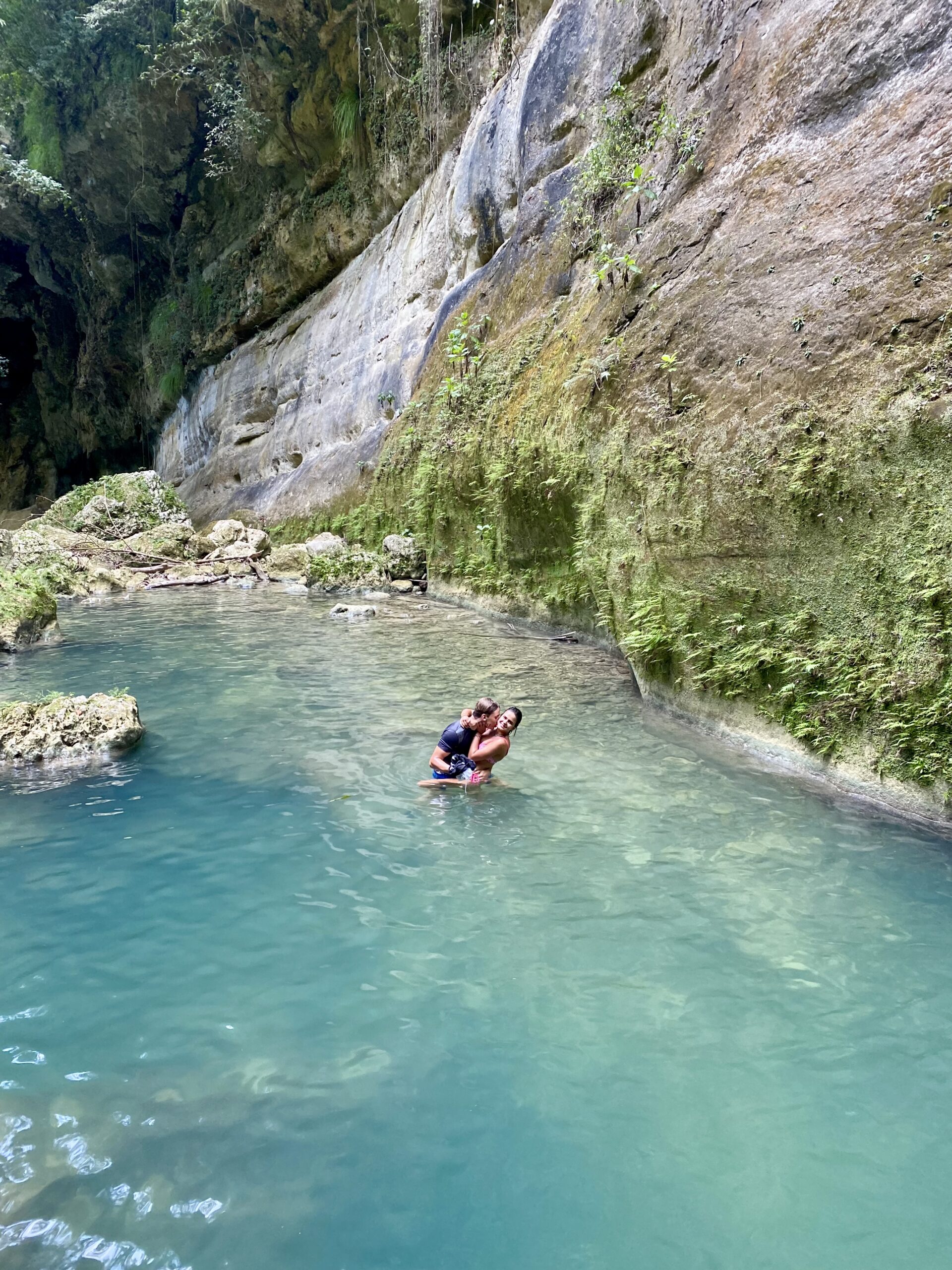 Couple swimming canyon