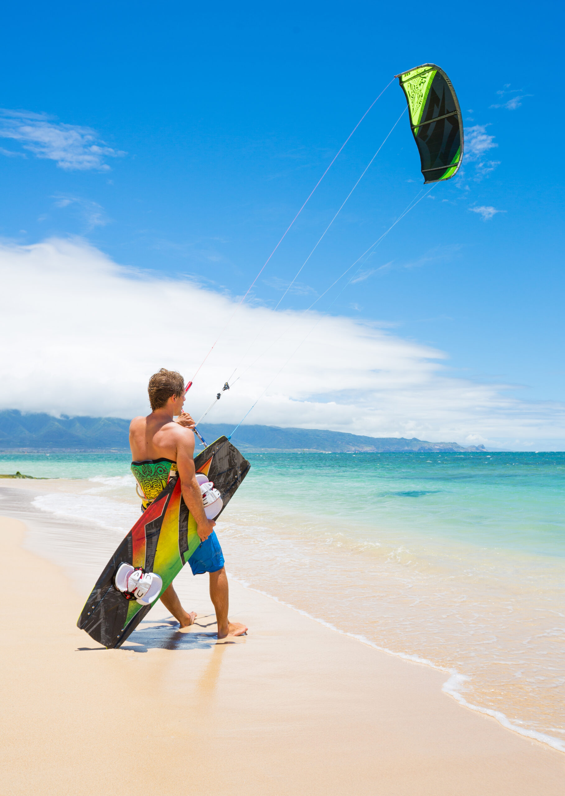 Preparing to kiteboard on the beach