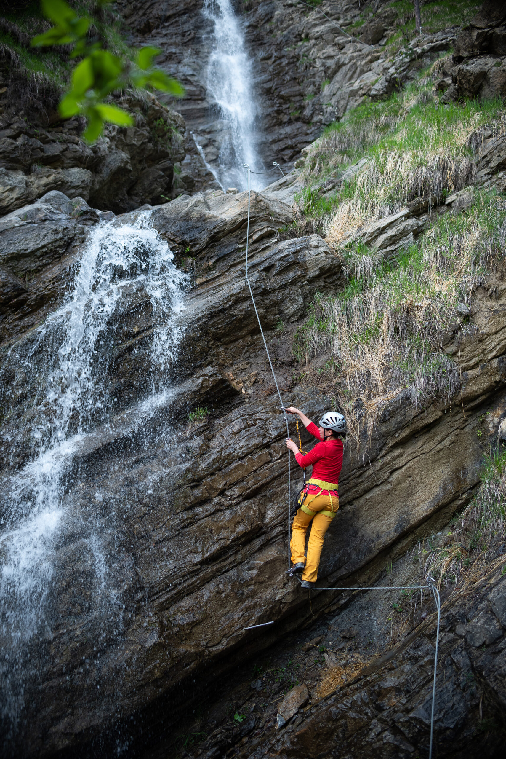 Rappelling near waterfall
