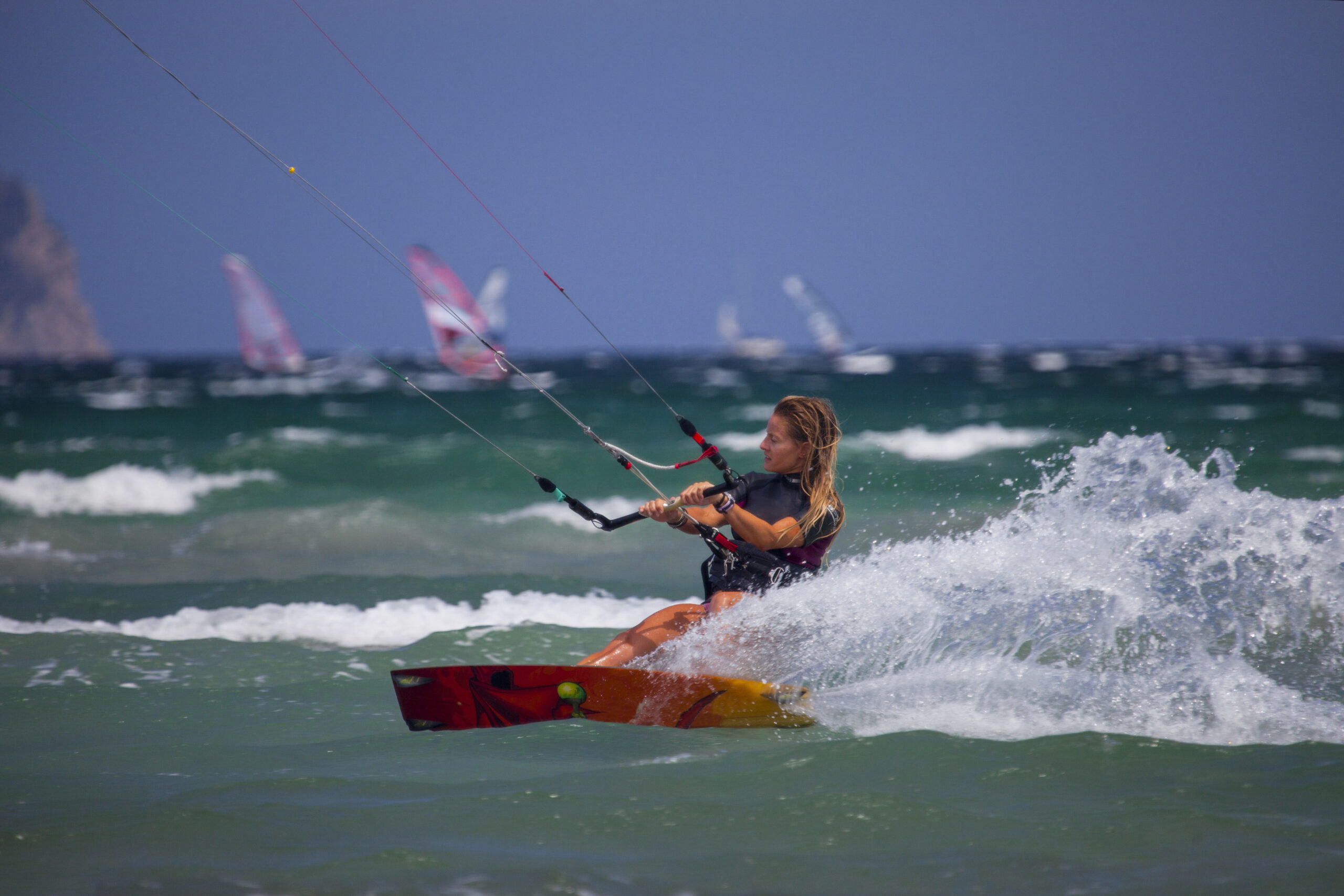 Woman kiteboarding at speed