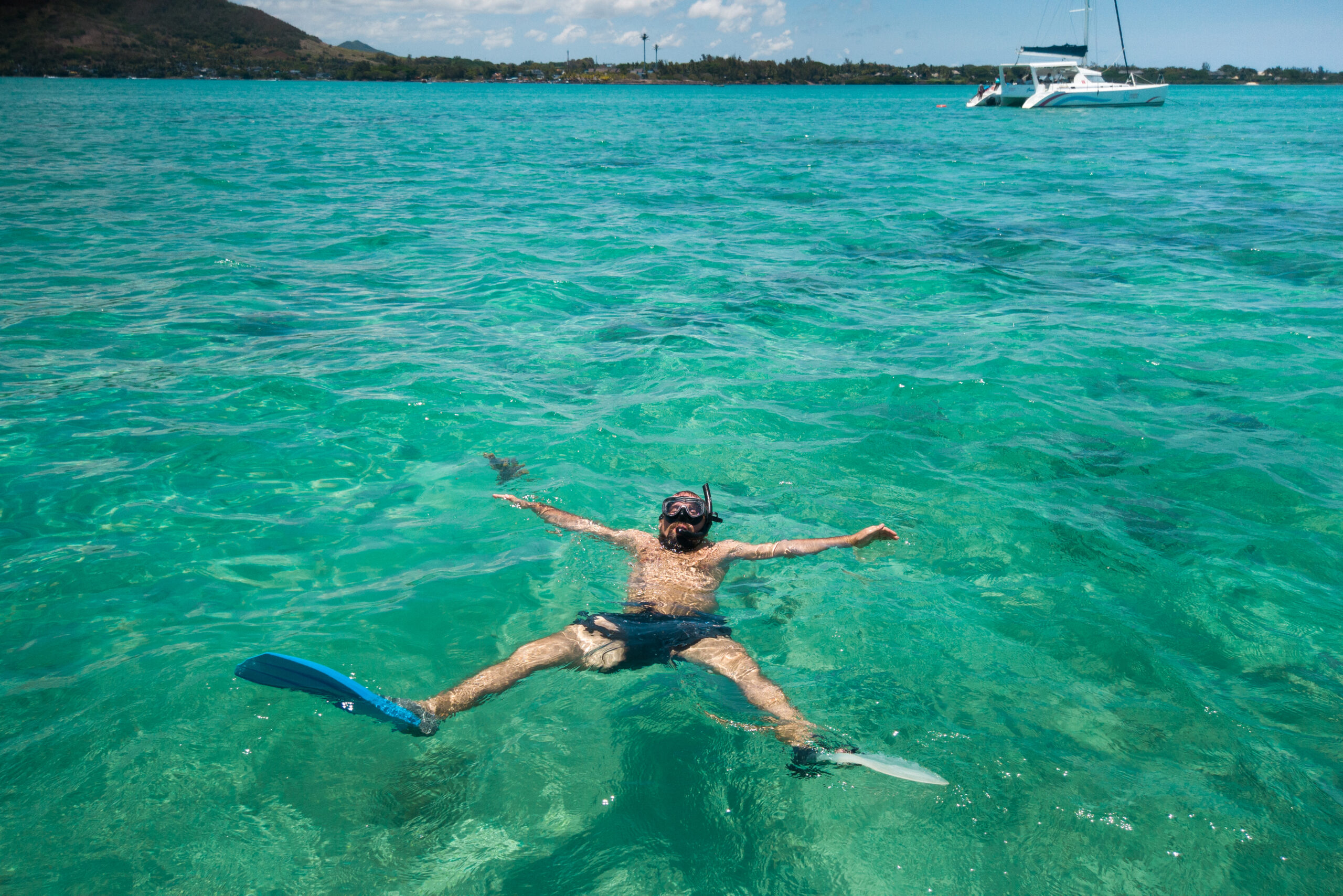 Snorkeler swimming in a tropical lagoon